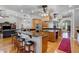 Spacious kitchen featuring custom wood cabinets, large island, breakfast bar and modern stainless steel appliances at 701 E 60 Hwy, Plant City, FL 33567