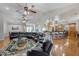 Bright open layout combining the living area and kitchen, complete with hardwood floors and ceiling fans at 701 E 60 Hwy, Plant City, FL 33567