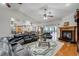 Open-concept living space with wood floors, a fireplace, and sliding doors for seamless indoor-outdoor living at 701 E 60 Hwy, Plant City, FL 33567