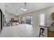 Expansive living room with tiled floors, lots of natural light, ceiling fans, and access to outdoor patio at 701 E 60 Hwy, Plant City, FL 33567