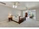Spacious main bedroom featuring ceiling fans, neutral walls, and sitting area with nice nature views at 701 E 60 Hwy, Plant City, FL 33567