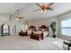 Large main bedroom with two beds, a sitting area, and plenty of natural light at 701 E 60 Hwy, Plant City, FL 33567