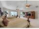 Spacious main bedroom with two beds, a TV, a seating area, and access to the outdoors at 701 E 60 Hwy, Plant City, FL 33567