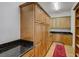 Walk-in pantry features ample storage, wood shelving and cabinetry, plus granite counters and convenient layout at 701 E 60 Hwy, Plant City, FL 33567