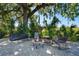 Outdoor patio with comfortable seating around a cozy fire pit, perfect for relaxing and entertaining at 701 E 60 Hwy, Plant City, FL 33567