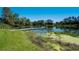 Dock with water access with surrounding algae, offering a serene setting for relaxation and recreation at 701 E 60 Hwy, Plant City, FL 33567