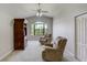 Bright sitting room featuring vaulted ceiling, ceiling fan, nature views, and built in shelving at 701 E 60 Hwy, Plant City, FL 33567
