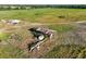 Aerial view of well and equipment on a vast rural property, showcasing potential for agricultural use at 701 E 60 Hwy, Plant City, FL 33567