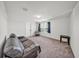 Inviting bedroom offering a comfortable seating area and natural light from windows at 1009 Golden Shiner Ave, Ruskin, FL 33570