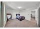 This cozy bedroom features a dark wood bed frame and a light-filled window at 1009 Golden Shiner Ave, Ruskin, FL 33570