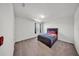 A comfortable bedroom shows a bed with colorful linens and neutral walls at 1009 Golden Shiner Ave, Ruskin, FL 33570