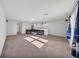 Large bonus room with plush carpet, recessed lighting, and comfortable seating area at 1009 Golden Shiner Ave, Ruskin, FL 33570