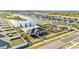 A high angle view of the neighborhood pool and playground in a well manicured community at 1009 Golden Shiner Ave, Ruskin, FL 33570