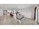 Open dining area with tile flooring, a kitchen island, and modern lighting at 1009 Golden Shiner Ave, Ruskin, FL 33570