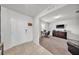 Inviting foyer with tile flooring and a view into the adjacent office space with desk and TV at 1009 Golden Shiner Ave, Ruskin, FL 33570