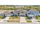 Charming two-story home with a well-manicured lawn, a two-car garage, and a welcoming front entrance at 1009 Golden Shiner Ave, Ruskin, FL 33570