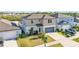 Aerial view of the front exterior of this two story home with a two-car garage at 1009 Golden Shiner Ave, Ruskin, FL 33570