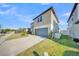 Two-story home with a well-maintained lawn and a gray two-car garage at 1009 Golden Shiner Ave, Ruskin, FL 33570