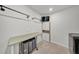 Functional laundry room with ample counter space, storage, and modern appliances at 1009 Golden Shiner Ave, Ruskin, FL 33570