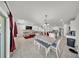 Open-concept living area with dining space, a comfortable sofa, and tile floors at 1009 Golden Shiner Ave, Ruskin, FL 33570