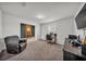 Comfortable office space with carpet, desk, computer, and leather chair, ideal for remote work at 1009 Golden Shiner Ave, Ruskin, FL 33570