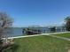 Backyard features a dock and boatlift offering convenient waterfront access at 1140 Boca Ciega Isle Dr, St Pete Beach, FL 33706