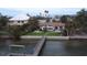 Waterfront property featuring a charming home and wooden dock for direct access to the water and boating activities at 1140 Boca Ciega Isle Dr, St Pete Beach, FL 33706