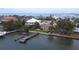 Stunning waterfront home with mature landscaping and private dock access for boating enthusiasts at 1140 Boca Ciega Isle Dr, St Pete Beach, FL 33706