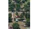 Aerial view of a red roofed home on a large lot with surrounding trees at 18818 Dorman Rd, Lithia, FL 33547