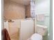 Bathroom featuring a white accessible bathtub with shower and a white toilet at 18818 Dorman Rd, Lithia, FL 33547