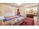 Bedroom featuring a bed and access to closet and bathroom with a double vanity at 18818 Dorman Rd, Lithia, FL 33547