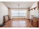 Dining room with hardwood floors, pendant lighting, and a large window at 18818 Dorman Rd, Lithia, FL 33547