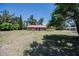 Single-story brick home with a red roof and a spacious front yard at 18818 Dorman Rd, Lithia, FL 33547