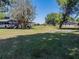Exterior shot of the outbuildings and the property's expansive lawn at 18818 Dorman Rd, Lithia, FL 33547