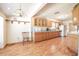 Bright kitchen with wooden cabinets, laminate floors, and modern appliances at 18818 Dorman Rd, Lithia, FL 33547