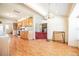 Kitchen that leads to the living room with a brick fireplace and red carpet at 18818 Dorman Rd, Lithia, FL 33547
