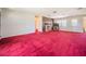 Open living room with wood paneling, brick fireplace and a door to the exterior at 18818 Dorman Rd, Lithia, FL 33547