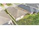 The home displays a screened lanai, and has a well-kept lawn, in a desirable neighborhood at 3134 Macintosh Rd, Land O Lakes, FL 34639
