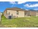 Expansive backyard with well-maintained lawn and a screened-in patio at 3134 Macintosh Rd, Land O Lakes, FL 34639