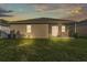Large backyard with a screen enclosed patio, perfect for outdoor relaxation and entertainment at 3134 Macintosh Rd, Land O Lakes, FL 34639