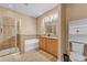 Bright bathroom with a walk-in shower, a soaking tub, and a double vanity at 3134 Macintosh Rd, Land O Lakes, FL 34639