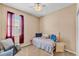 Cozy bedroom with natural lighting, a ceiling fan, and neutral wall colors at 3134 Macintosh Rd, Land O Lakes, FL 34639