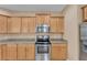 Bright kitchen with granite countertops, stainless steel appliances, and ample cabinet space at 3134 Macintosh Rd, Land O Lakes, FL 34639