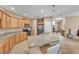 Kitchen featuring an island with granite countertops, stainless steel appliances, and a breakfast bar at 3134 Macintosh Rd, Land O Lakes, FL 34639