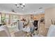 Open-concept living space featuring a seamless flow between dining, living, and kitchen areas at 3134 Macintosh Rd, Land O Lakes, FL 34639