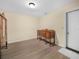 Empty bedroom with luxury vinyl flooring, closet and side door to the exterior at 115 W Lee St, Plant City, FL 33563