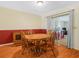 Dining area with a wooden table, chairs, and sliding glass doors that provide access to the outside at 115 W Lee St, Plant City, FL 33563