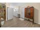Bright, airy kitchen with white cabinetry, ample storage, and modern appliances, connecting to an adjacent dining area at 115 W Lee St, Plant City, FL 33563