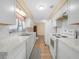 Bright kitchen featuring white cabinets, subway tile backsplash, and modern appliances at 115 W Lee St, Plant City, FL 33563