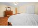 Main bedroom showcasing a ceiling fan and double door closet at 115 W Lee St, Plant City, FL 33563